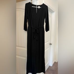 Black Jumpsuit with waist tie and pockets.